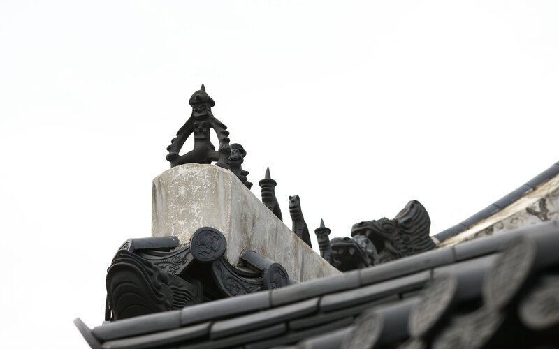 traditional roof tiles and figurines