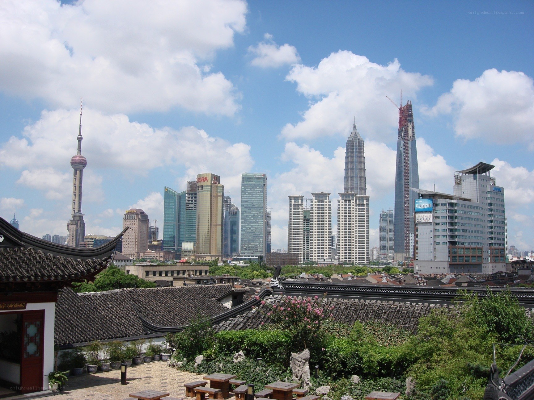 Traditional rooftops with Shanghai skyline