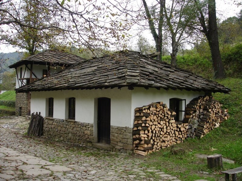 Traditional stone house with firewood