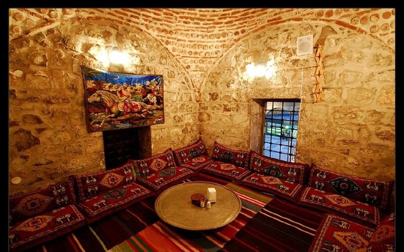 Traditional stone room with cushions