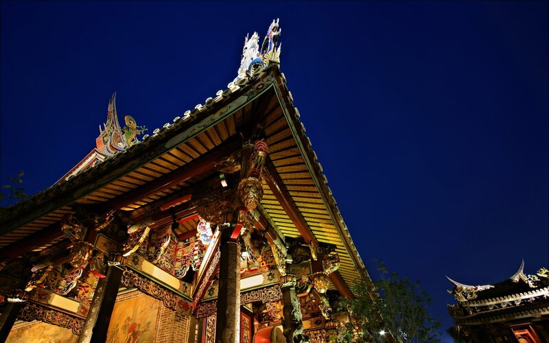 Traditional temple roof at night