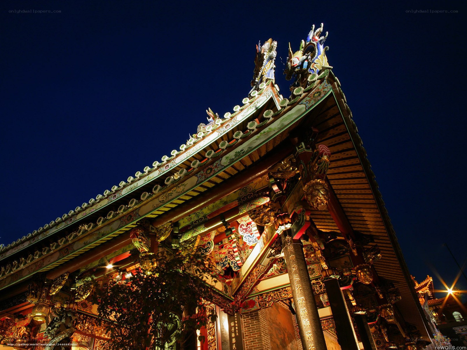 Traditional temple roof at night