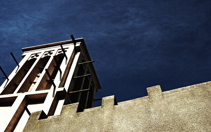 Traditional wind tower against blue sky