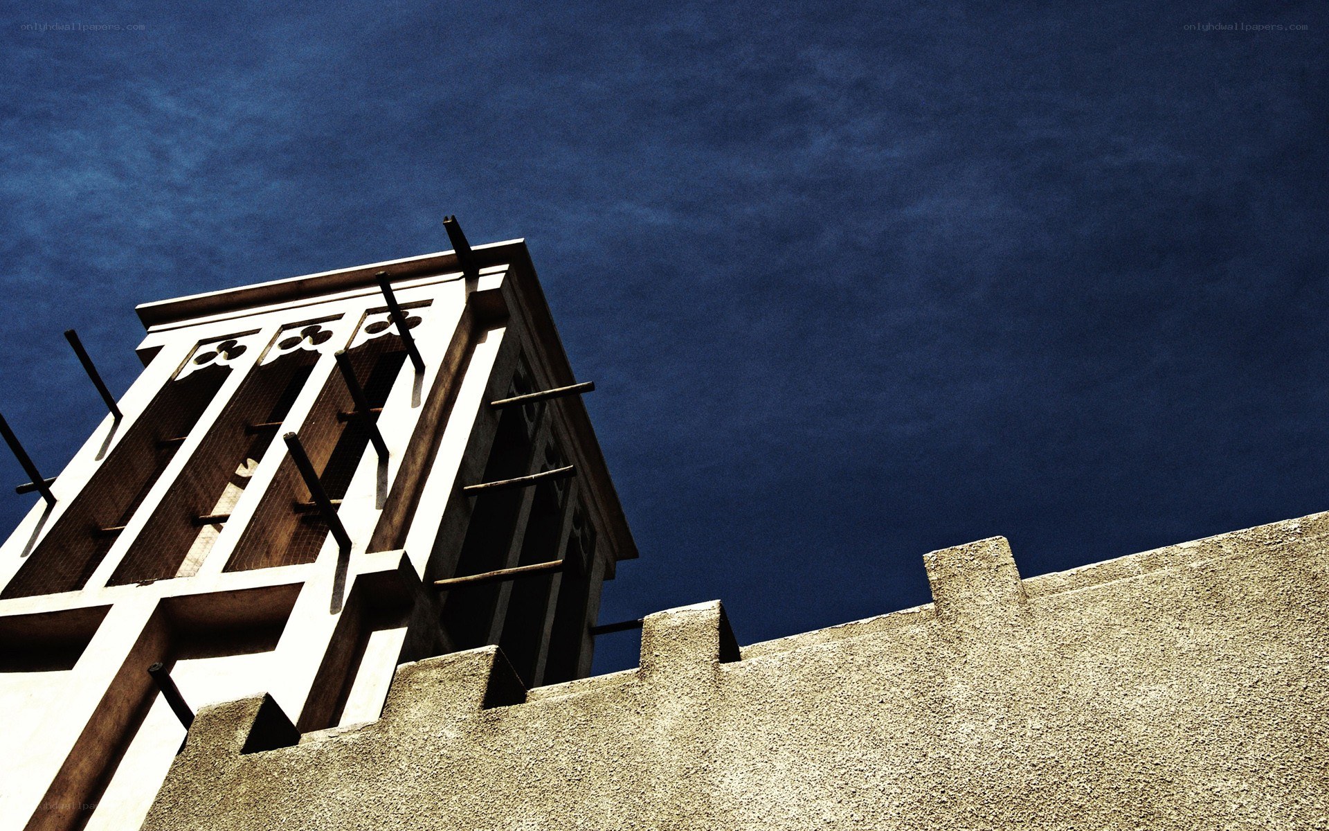 Traditional wind tower against blue sky