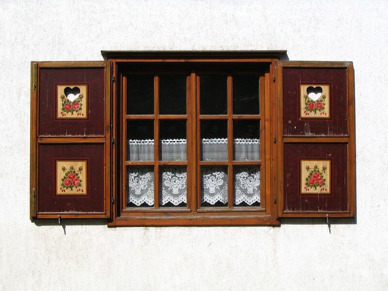traditional wooden window with shutters