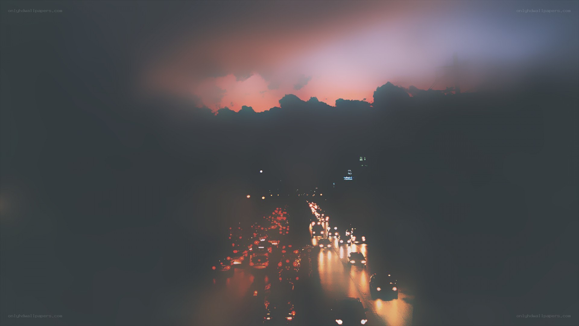 Traffic at dusk on a rainy highway
