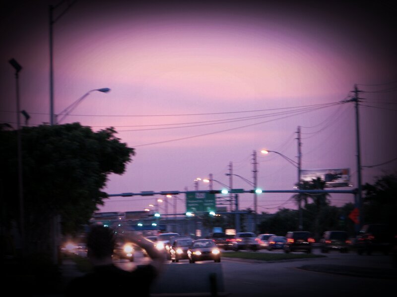 Traffic at dusk with purple sky