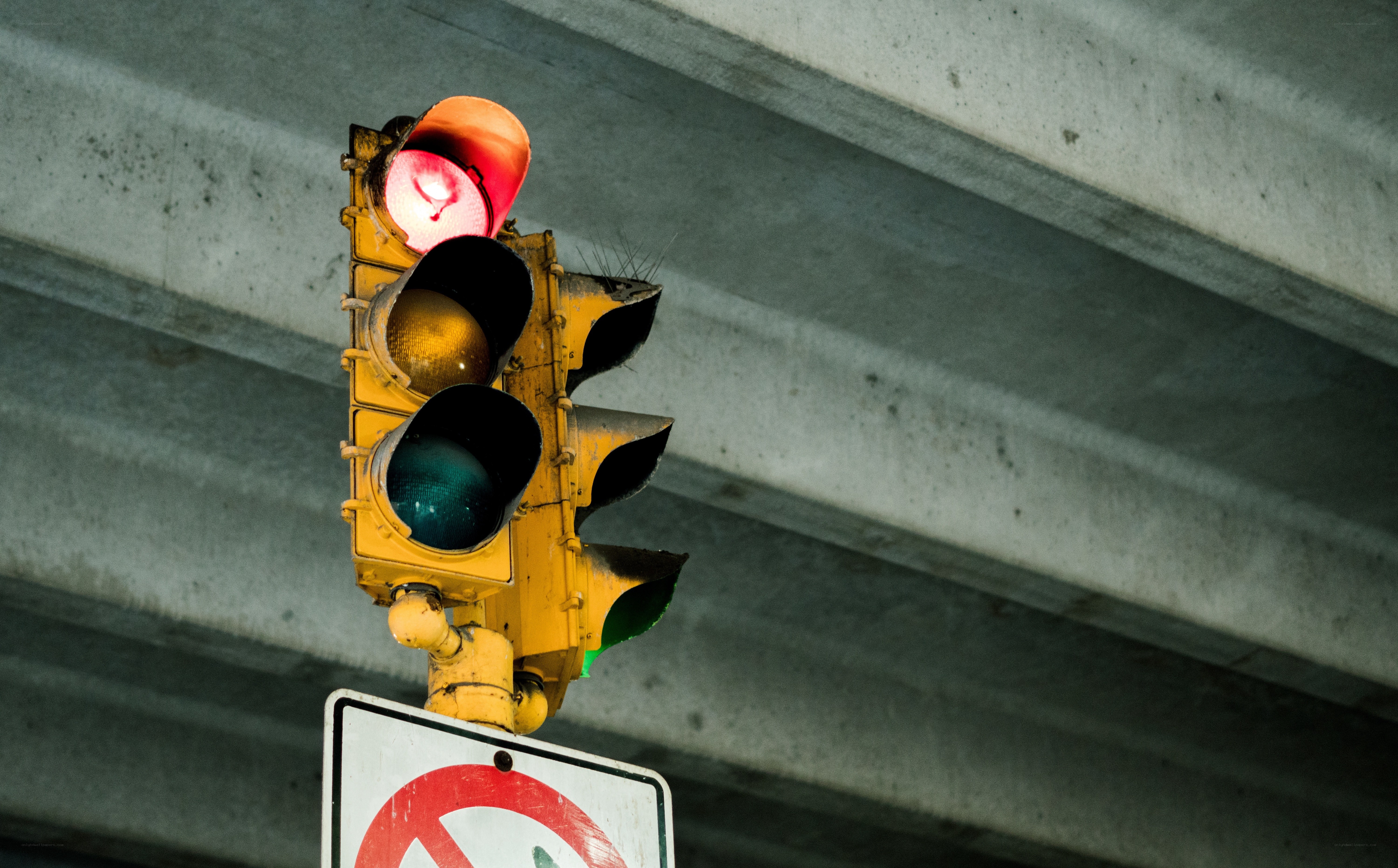 traffic light under concrete bridge