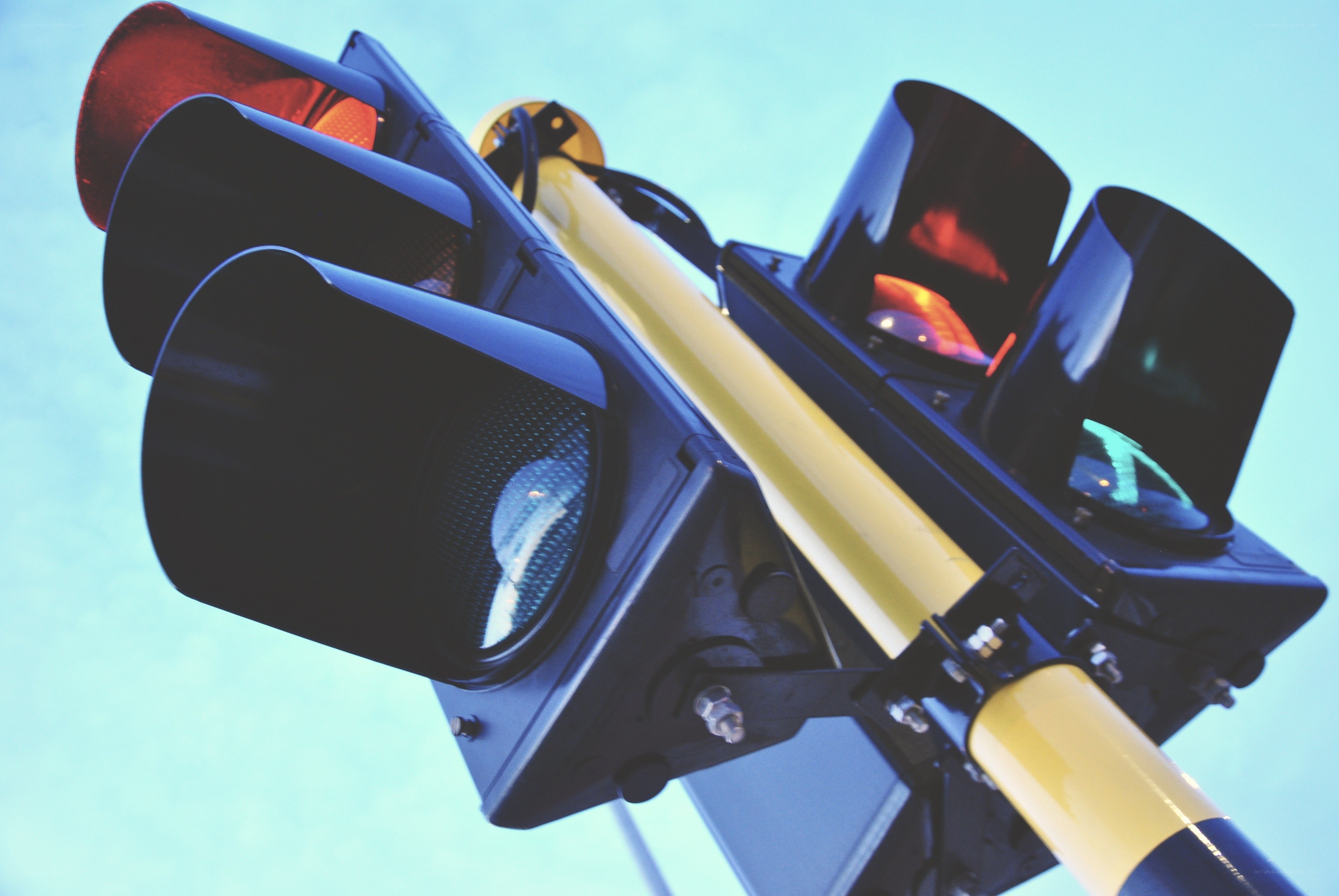 traffic lights against blue sky