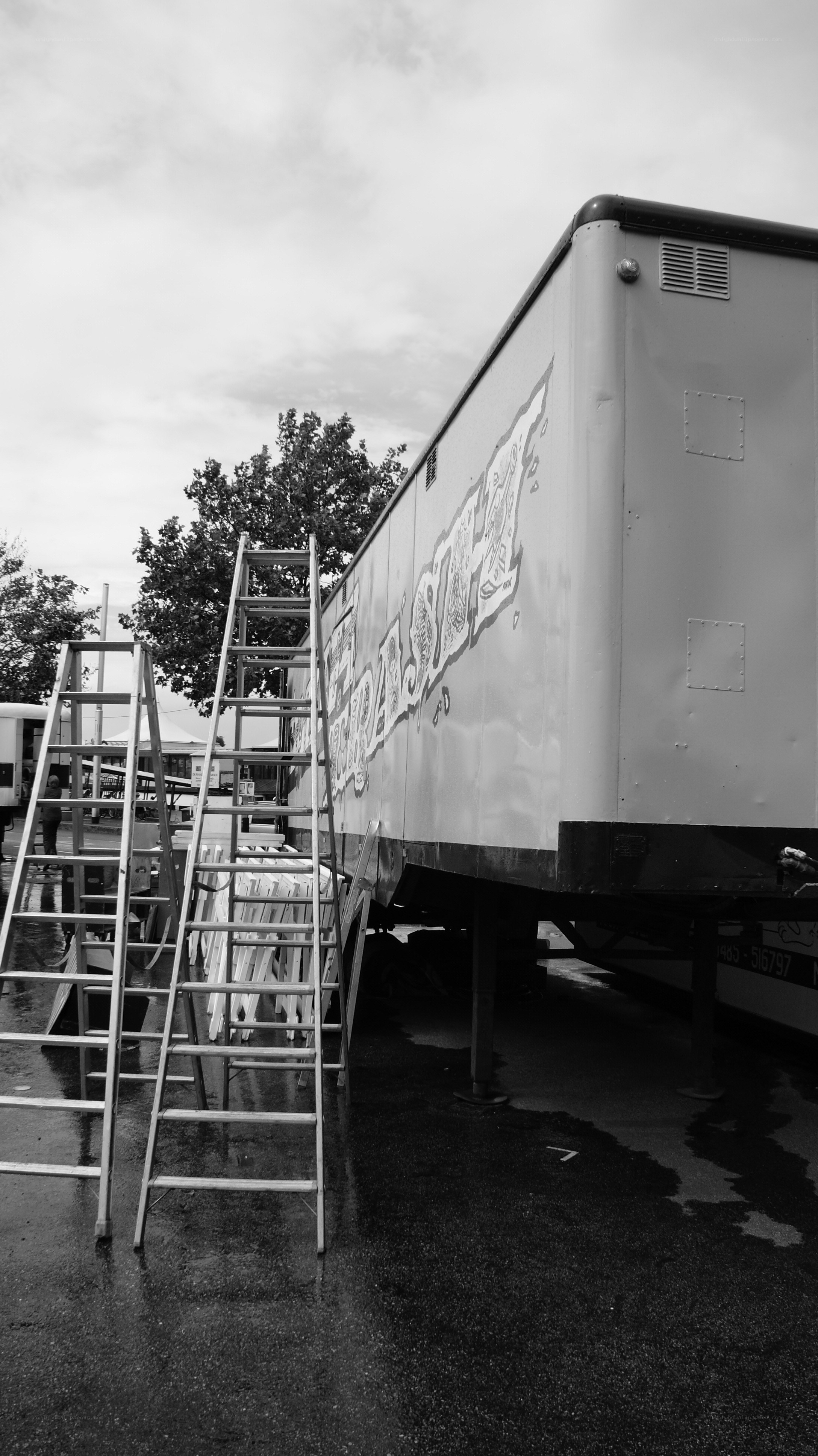 Trailer with graffiti and ladders