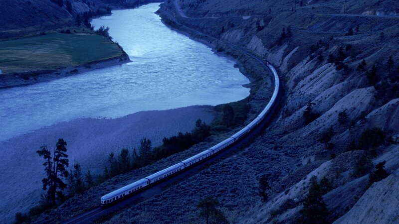 Train along a winding river