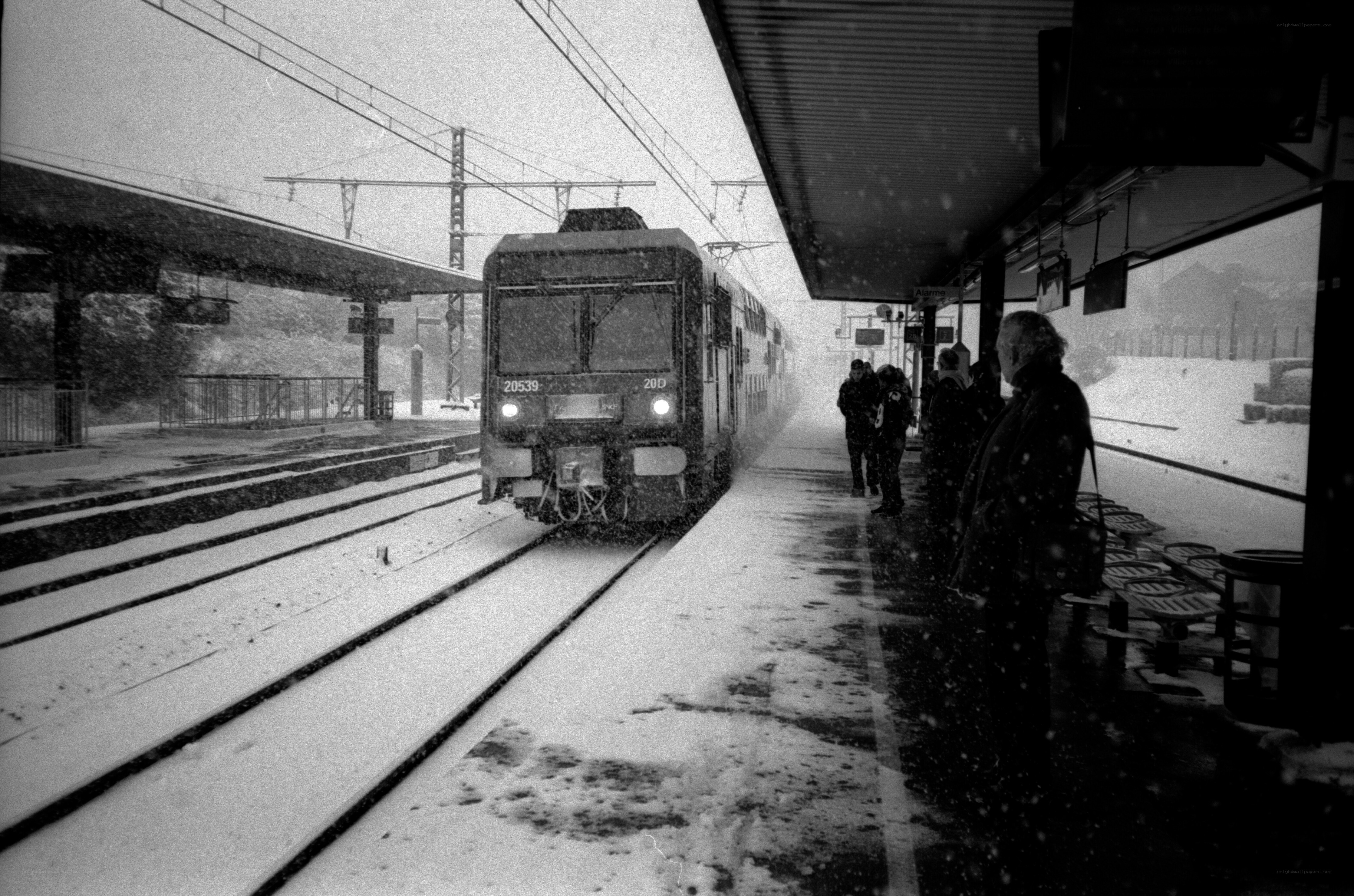 Train arriving at snowy station