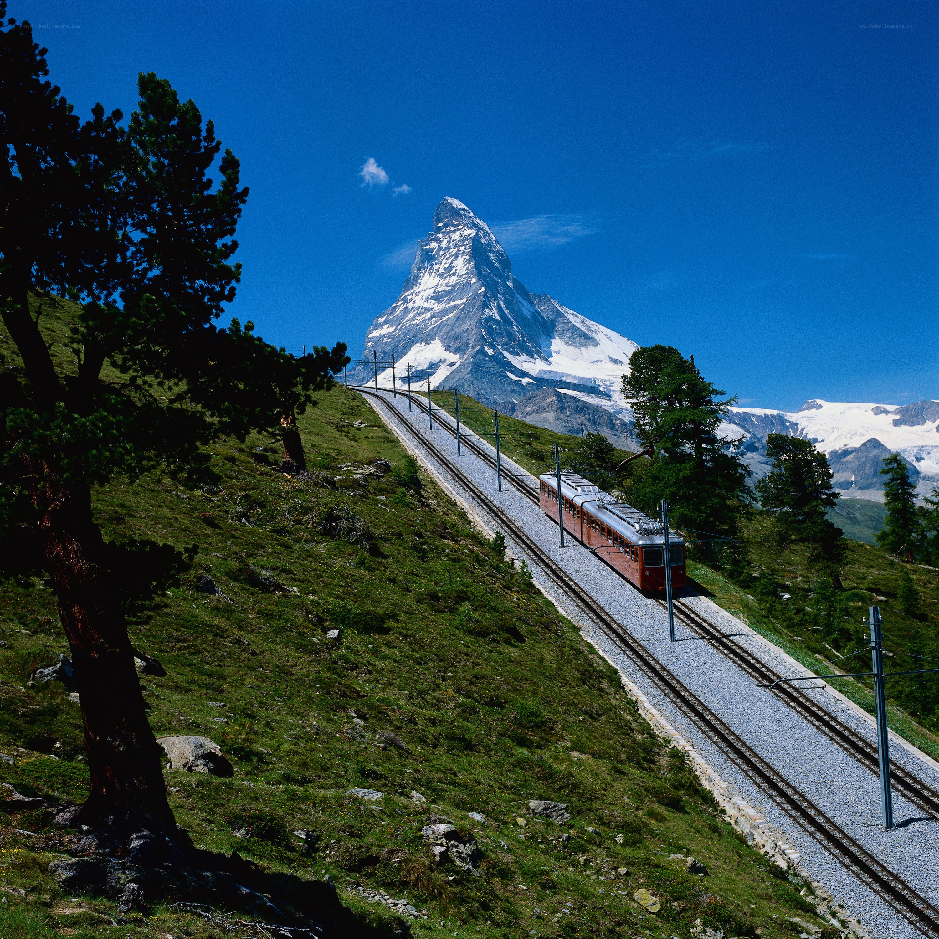Train ascending mountain with Matterhorn