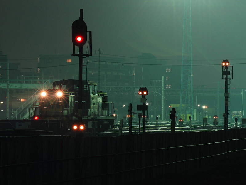 Train at a foggy railway yard