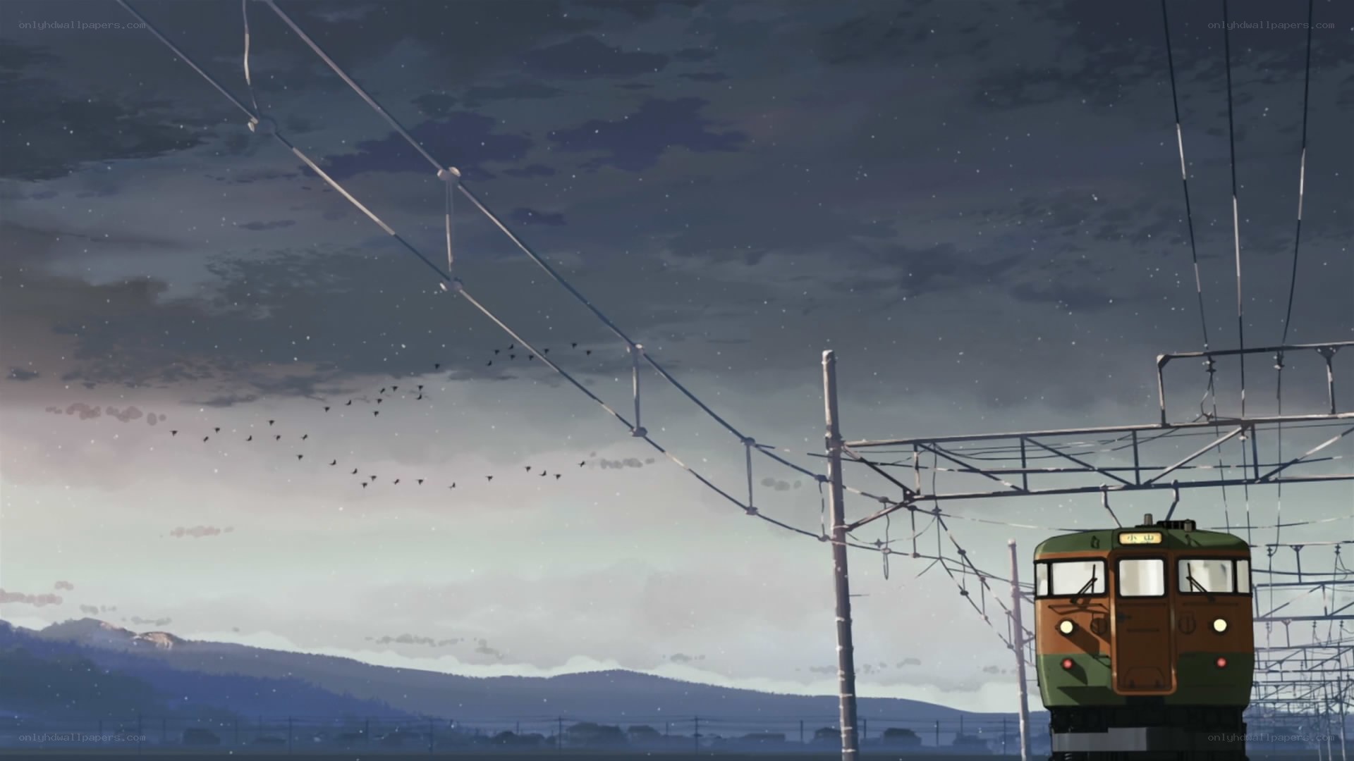 Train at dusk with birds flying