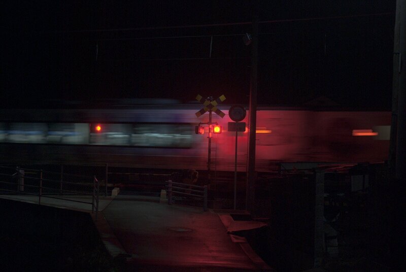 Train at Railroad Crossing — Black