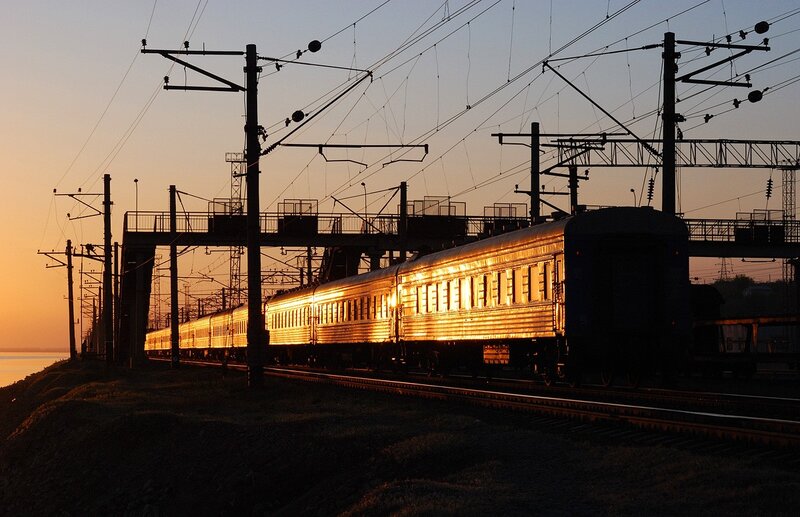Train at sunset by the river