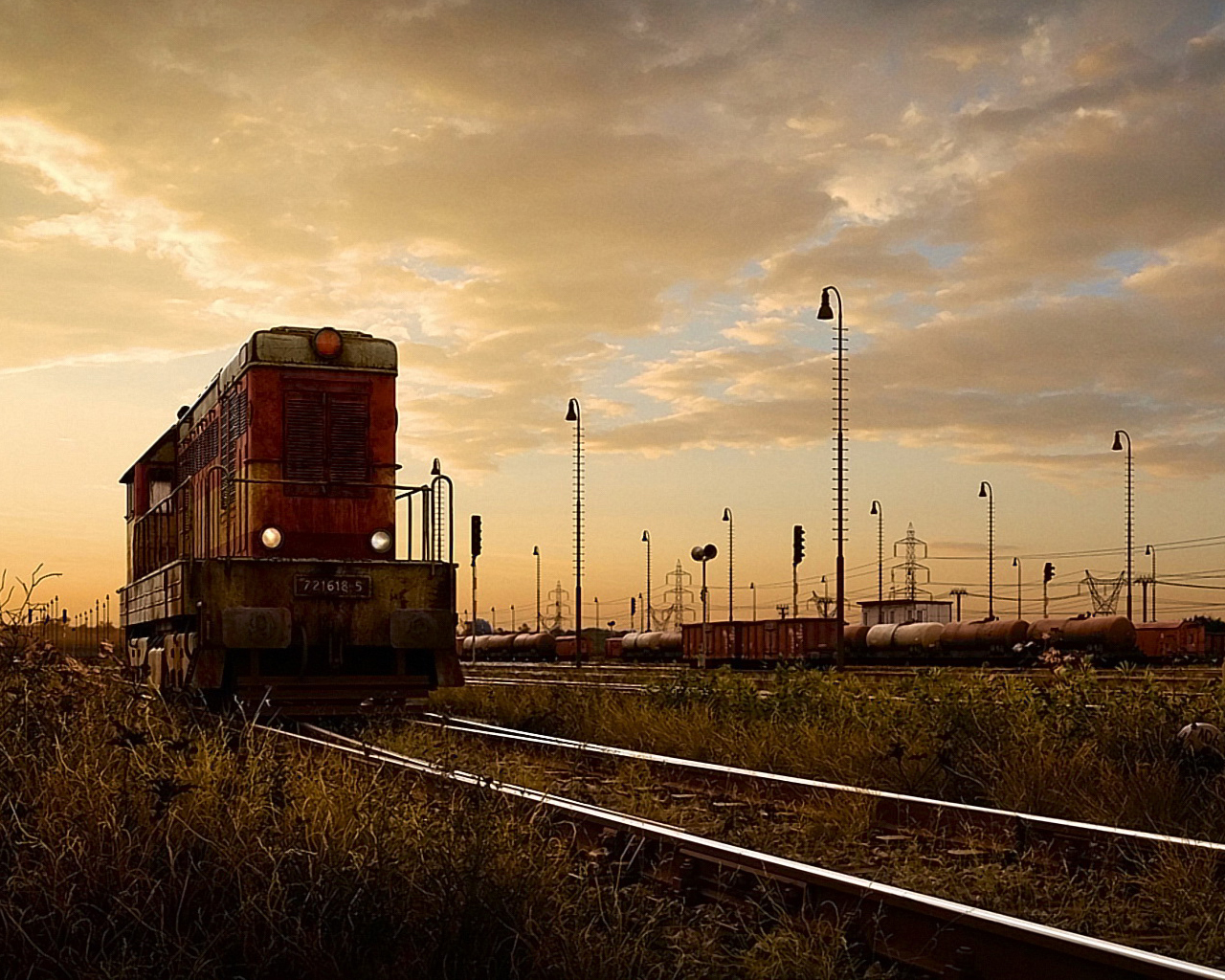 Train at sunset in a rail yard