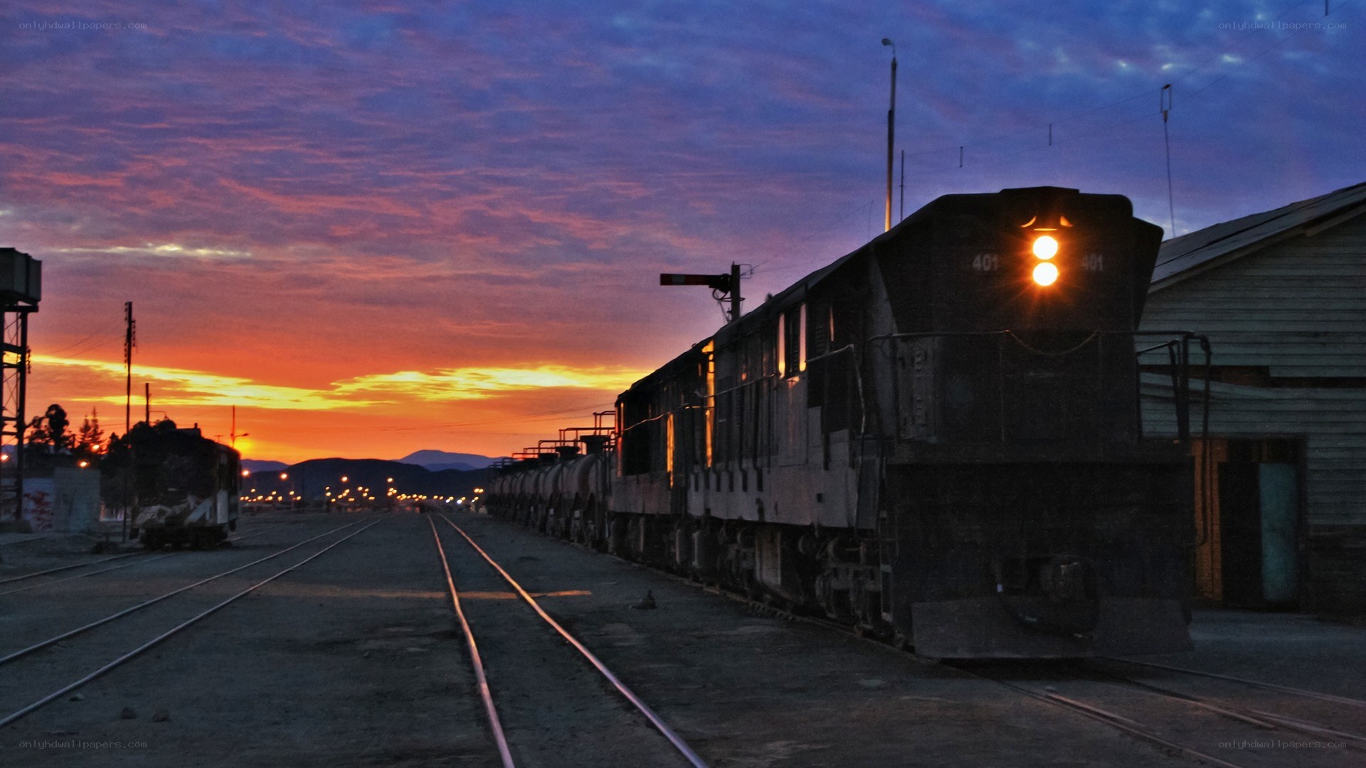 Train at sunset in a railway yard