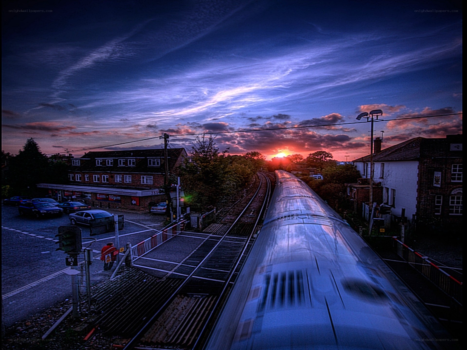 Train at sunset over crossing