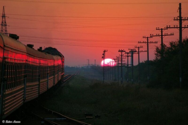 Train at sunset with red sky