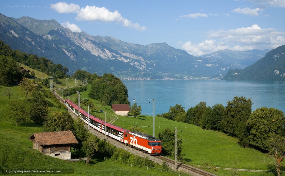 Train by a lake in the mountains