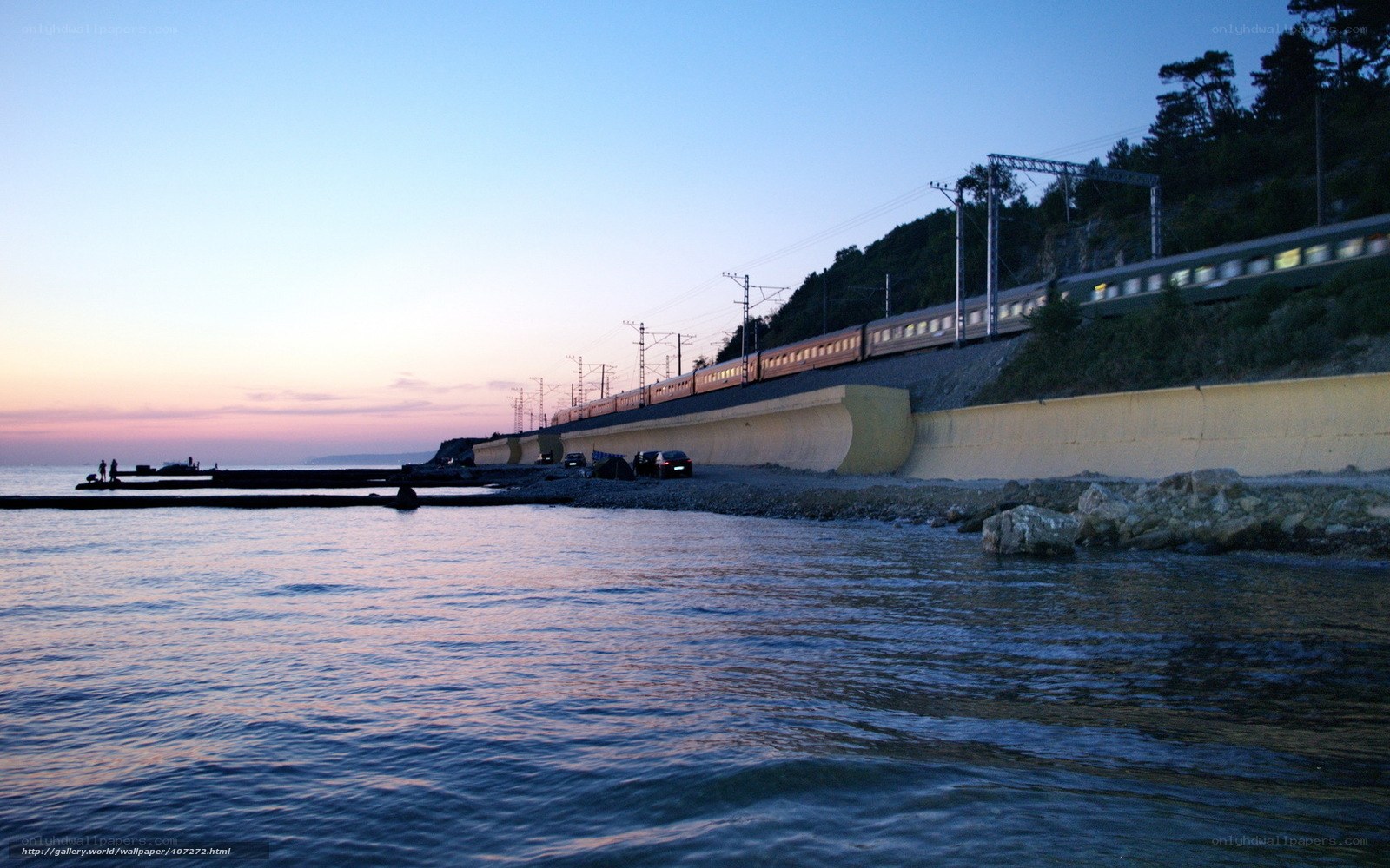 Train by the sea at dusk