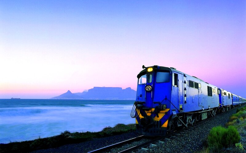 Train by the sea at sunset