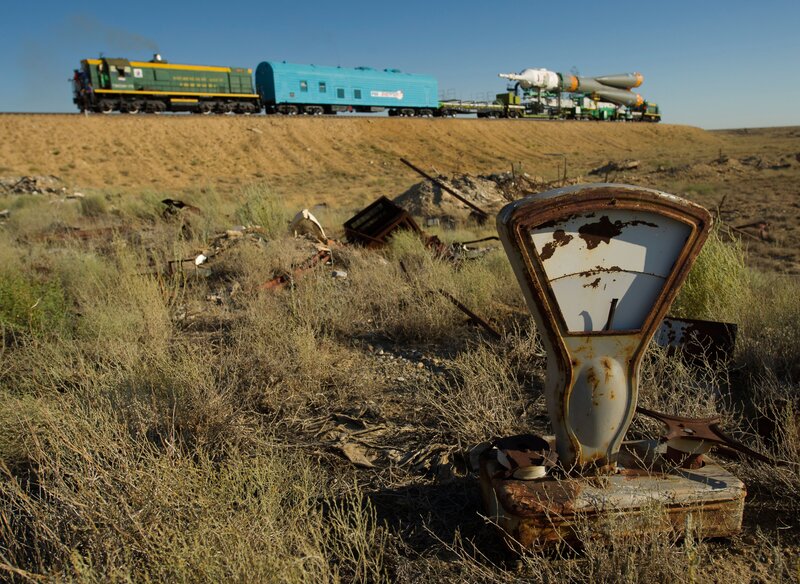 Train carrying rocket in desert