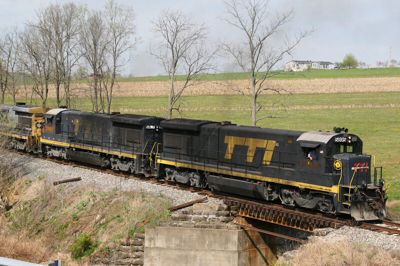Train crossing a bridge in the countryside
