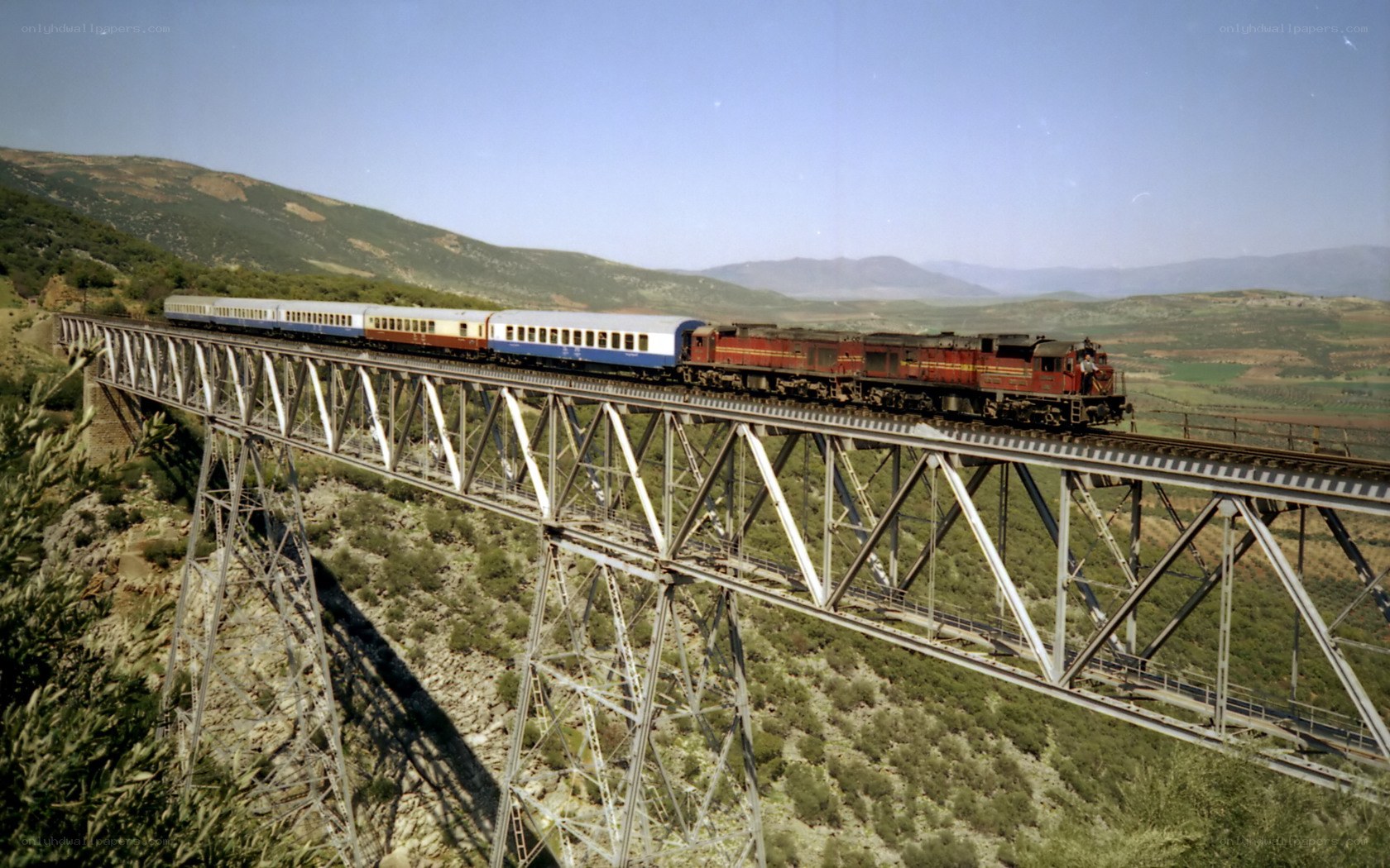 Train crossing a steel bridge