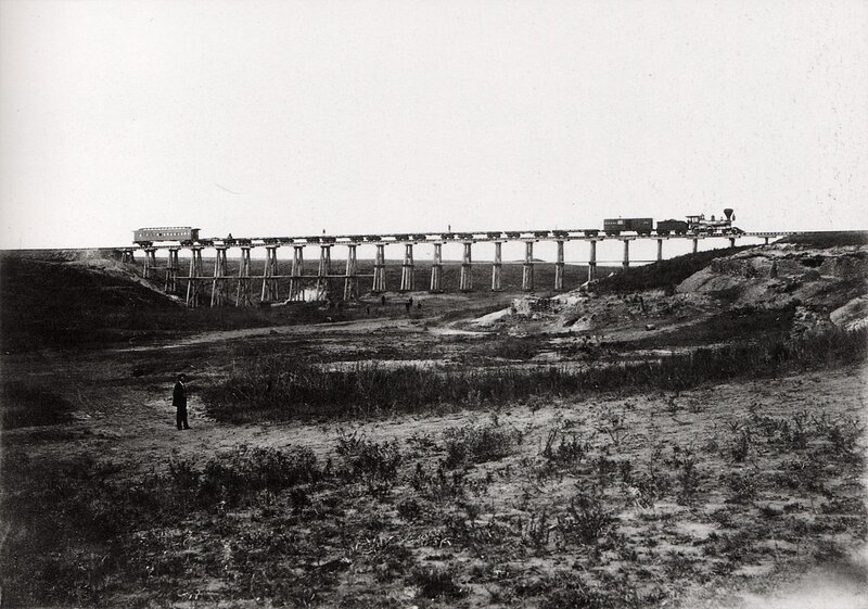 Train crossing a wooden trestle