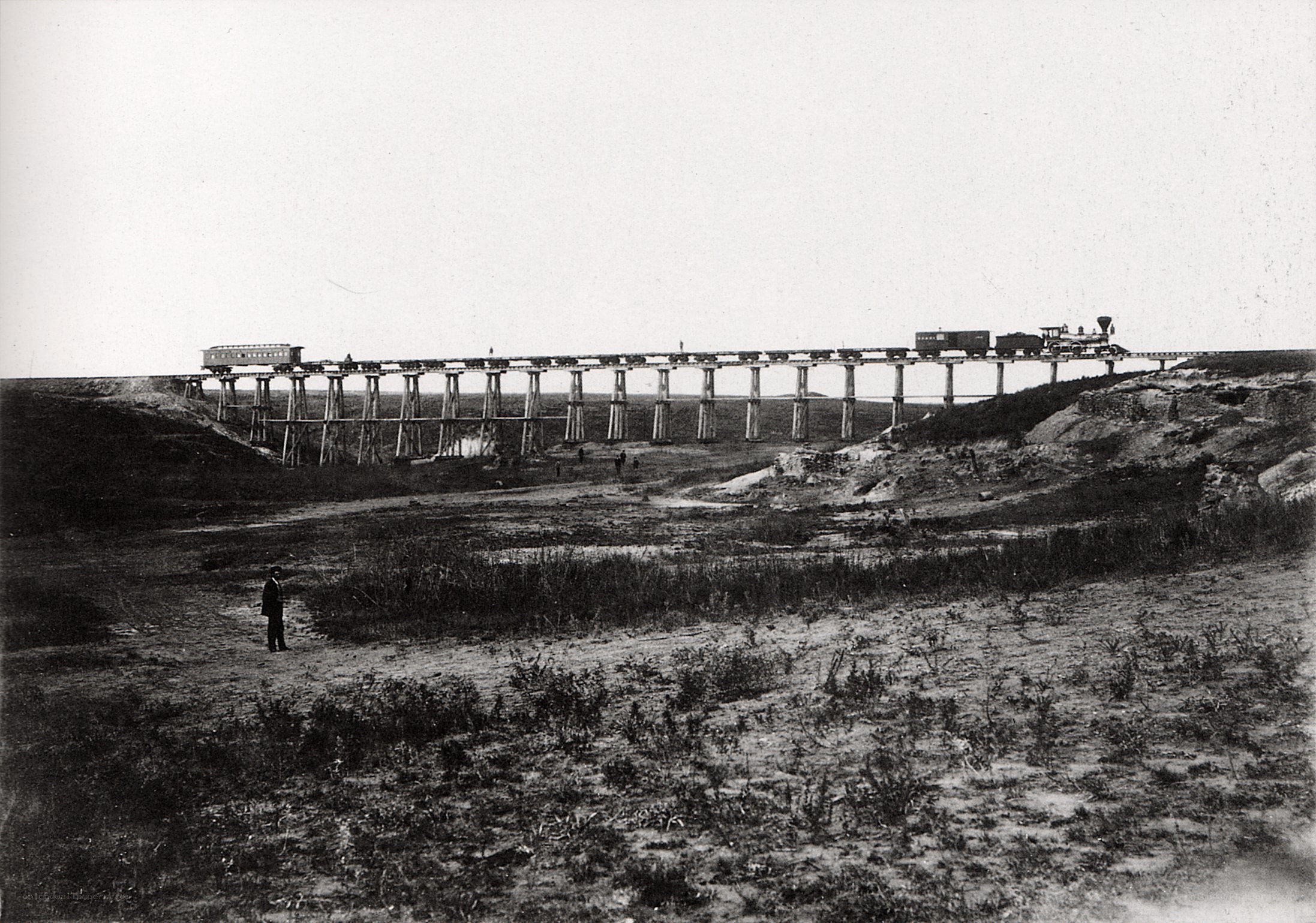 Train crossing a wooden trestle