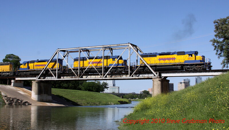 Train crossing bridge over river