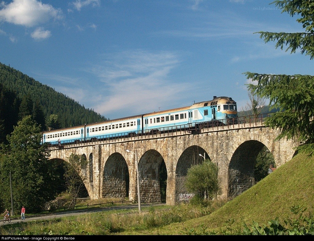 Train crossing stone viaduct