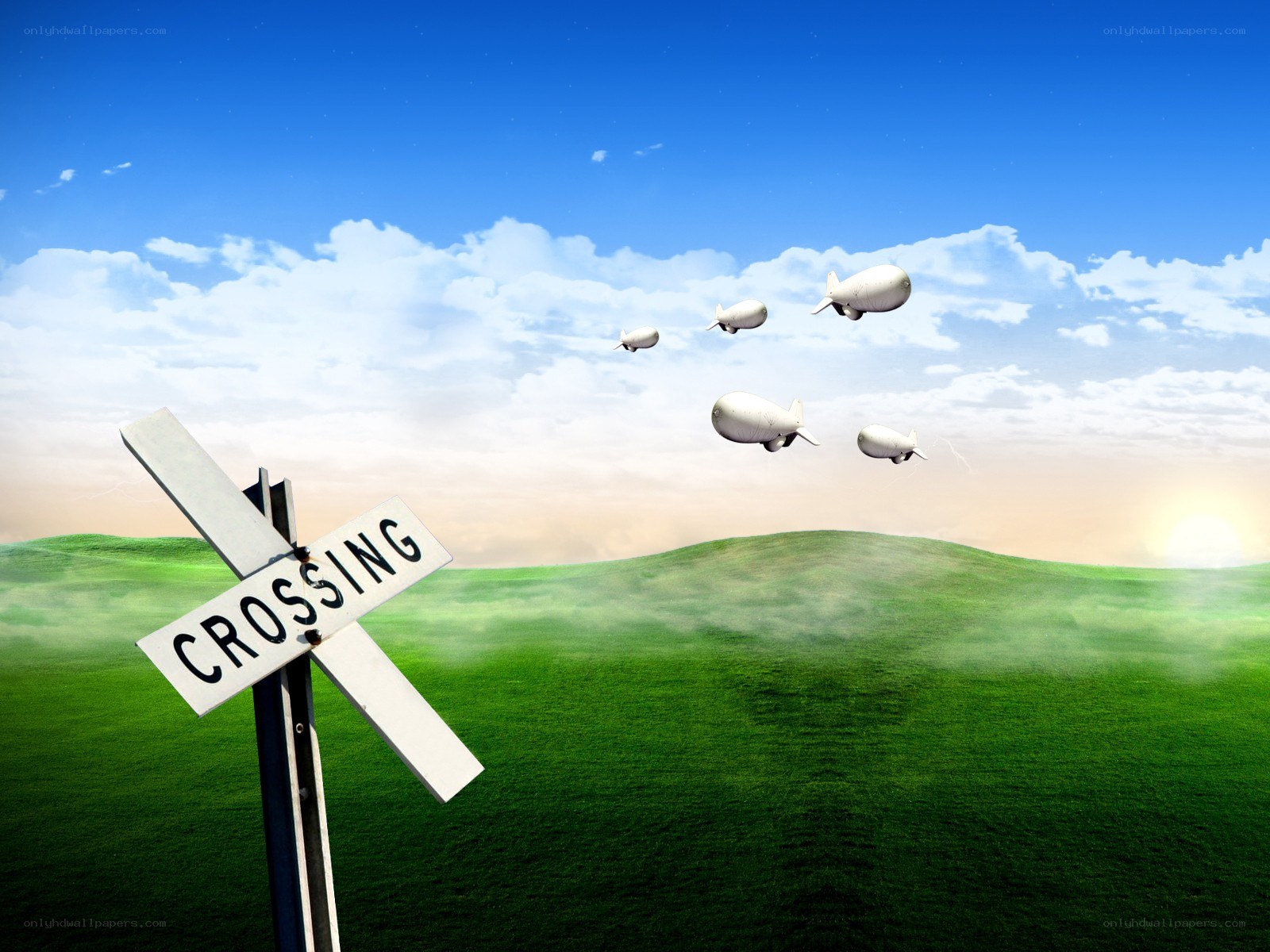 Train crossing with blimps