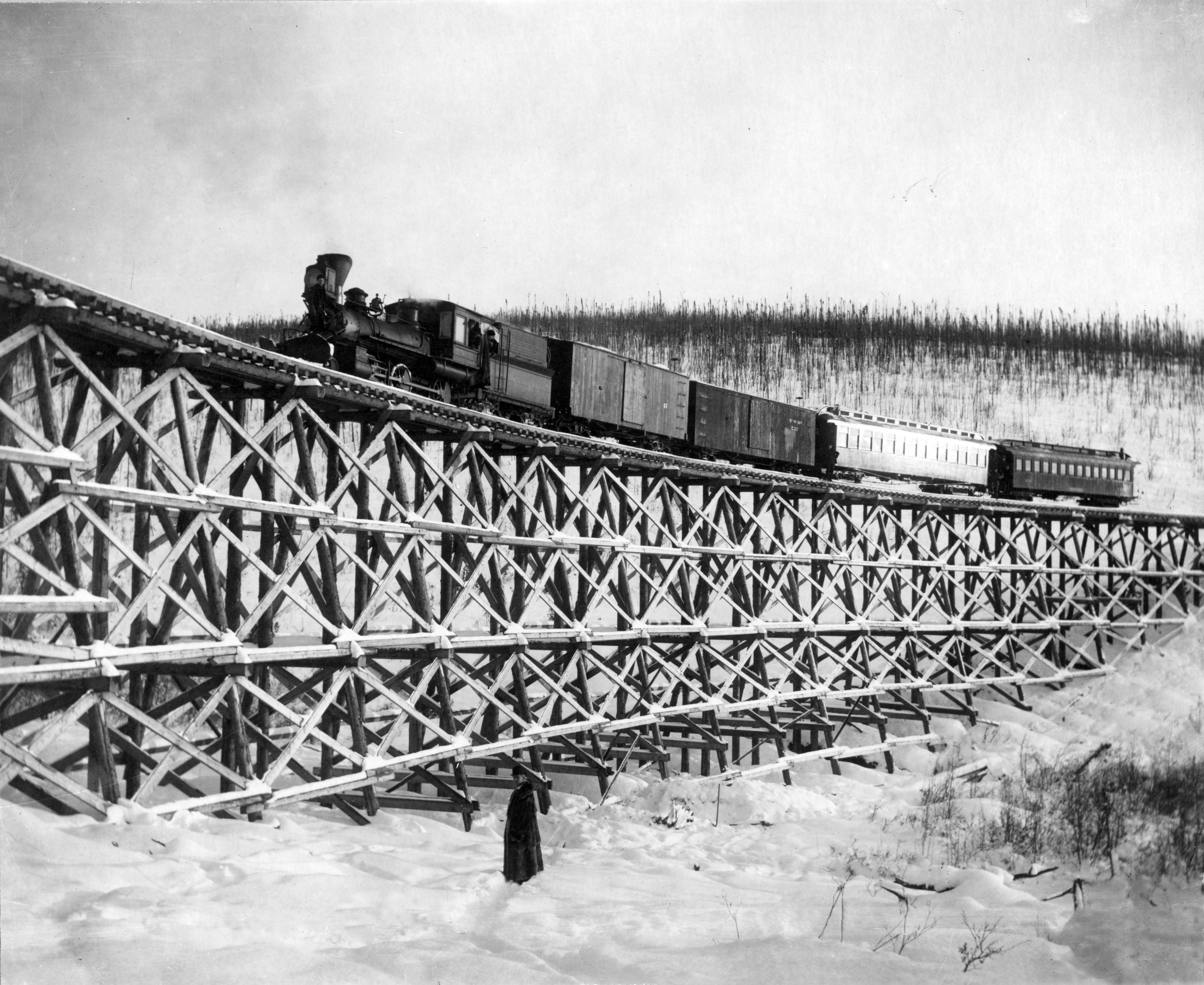 Train crossing wooden trestle