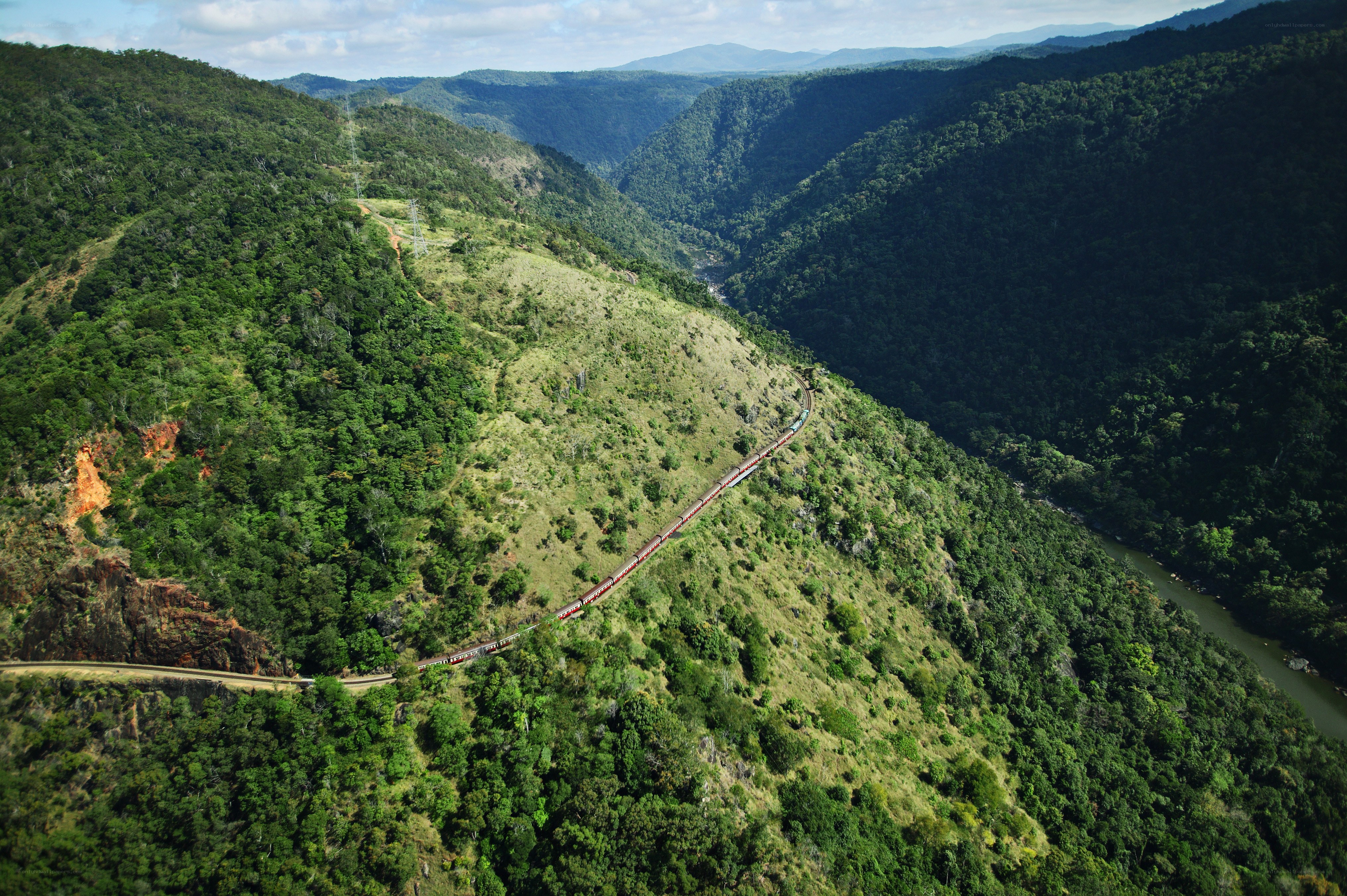 Train in a lush green valley