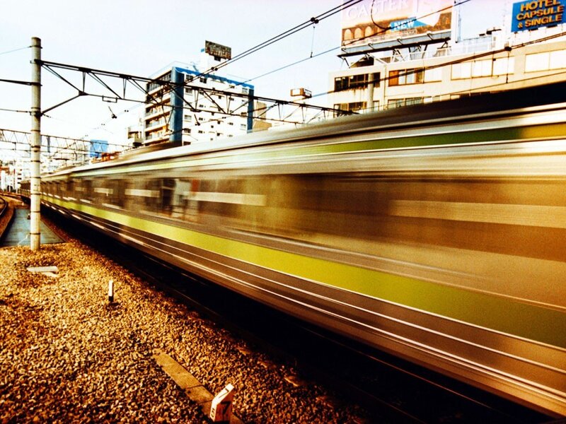 Train in motion at station