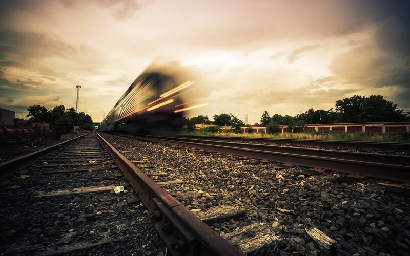 Train in motion at sunset