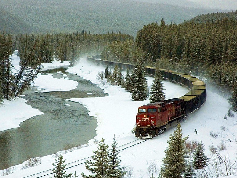 Train in snowy forest landscape