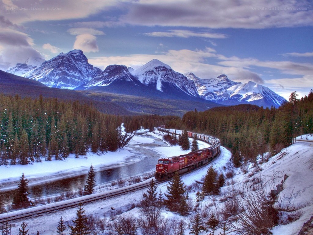 Train in snowy mountain landscape