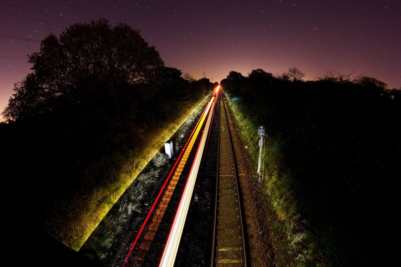 Train Light Trails at Night — Black