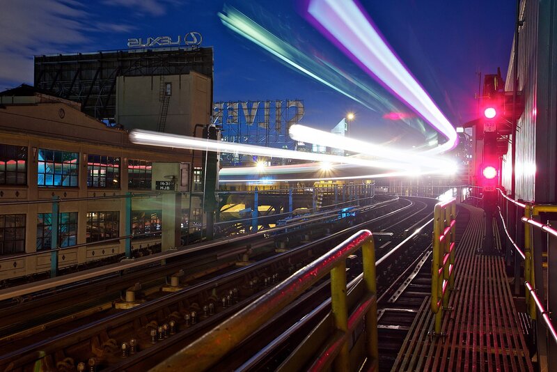 Train Light Trails at Night — Blue, Dramatic