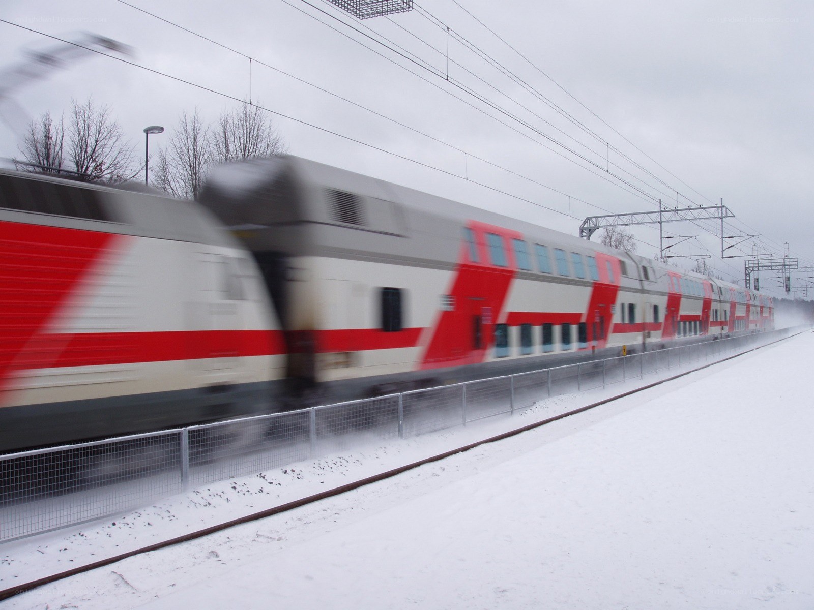 Train moving in snowy landscape
