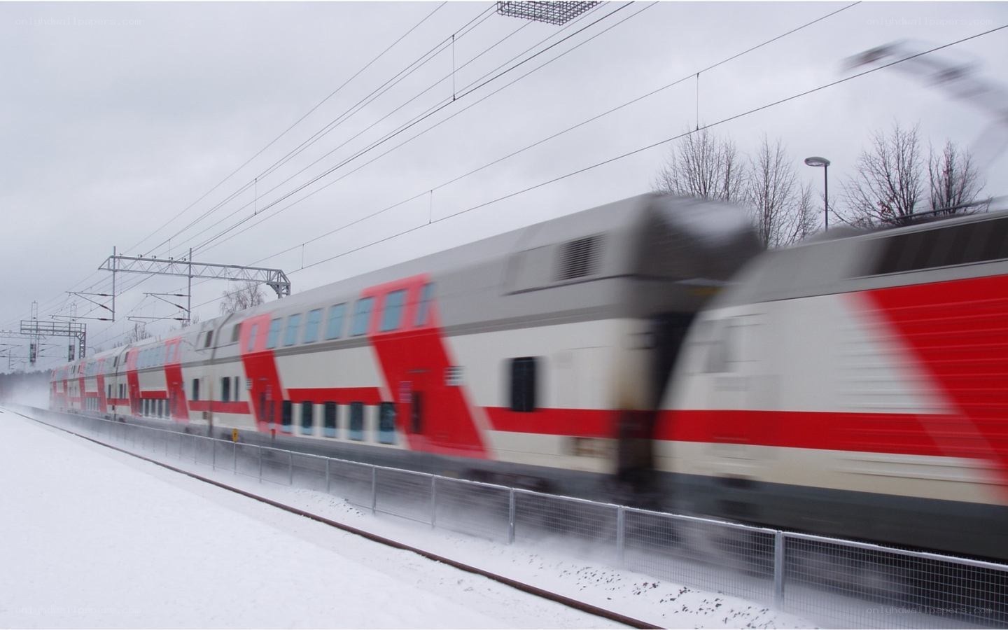 Train moving in snowy landscape