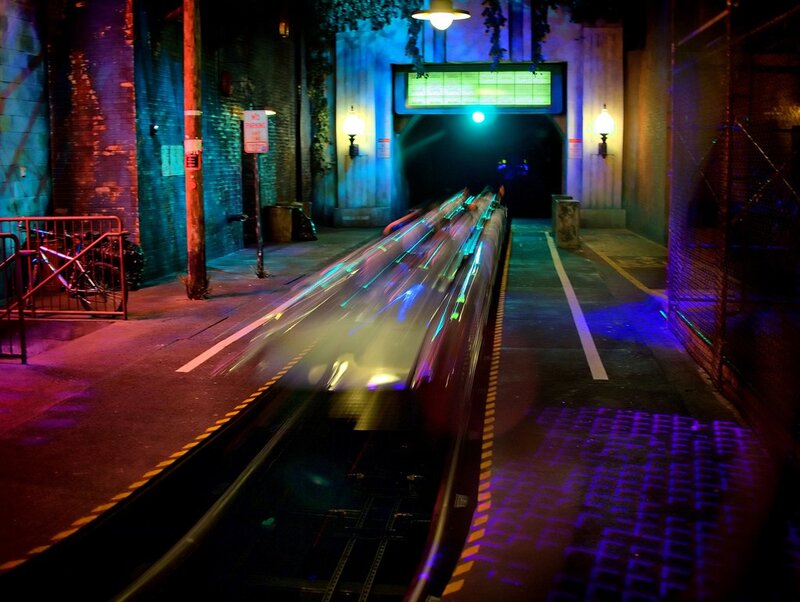 Train moving through tunnel at night