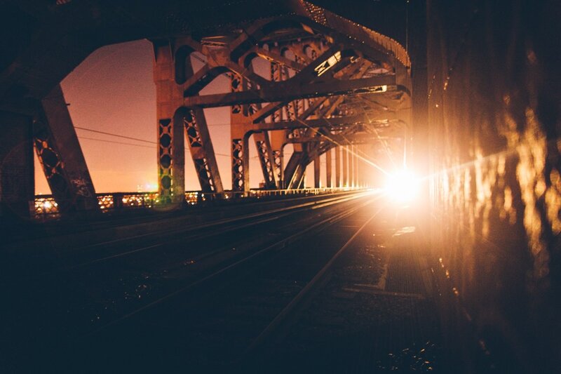 Train on a bridge at night