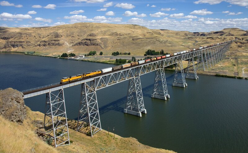 Train on a Bridge — Blue, Serene, Afternoon, Photograph, River