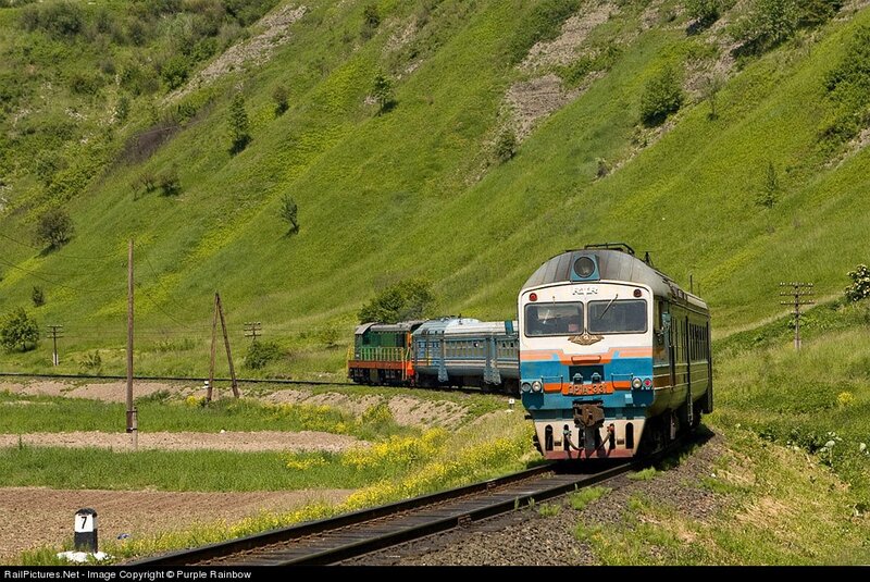 Train on a green hillside